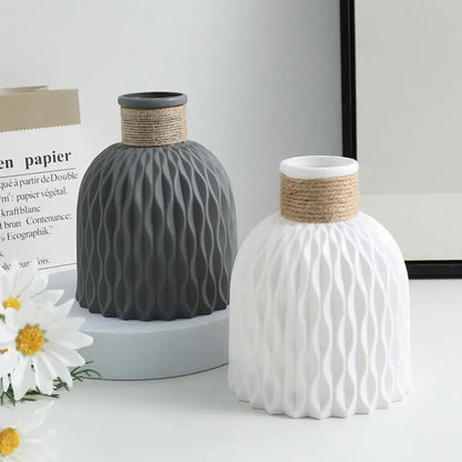 Two DecorBites™ water ripple plastic vases in matte gray and white with twine bands in modern Nordic style