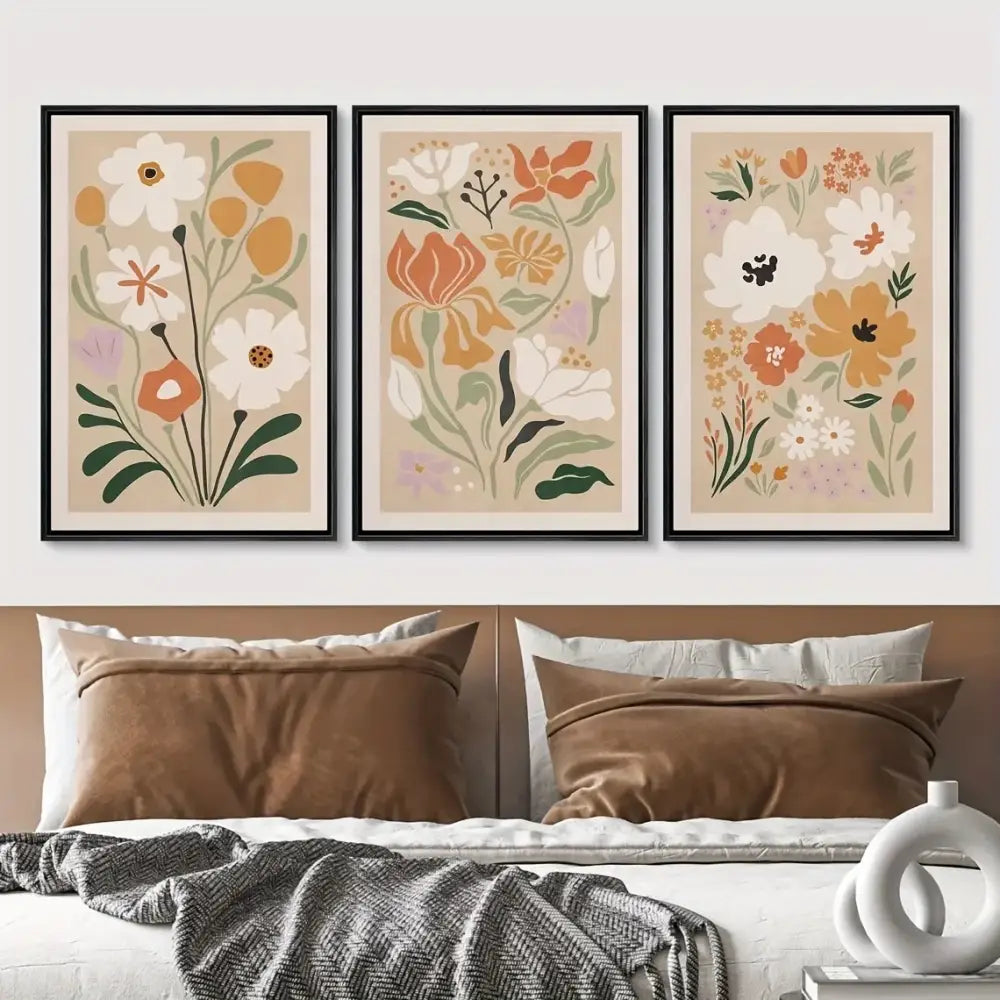 Three framed decorbites™ watercolor flower posters with soft beige backgrounds and stylized blossoms in pastel hues