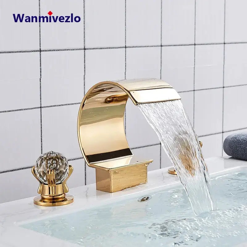 DecorBites™ waterfall bathroom basin faucet in gold with crystal knob and sleek curved polished metallic finish