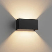 Black rectangular aluminum led wall sconce with sleek modern design emitting warm ambient light for indoor and outdoor use