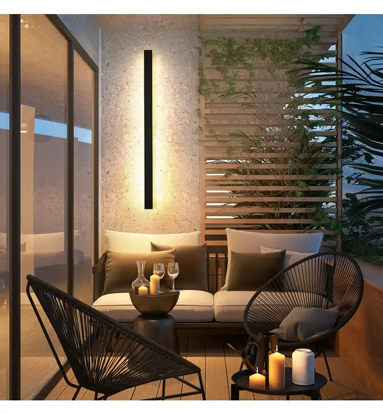 Black rectangular DecorBites™ waterproof LED outdoor wall light with warm ambient lighting for outdoor use