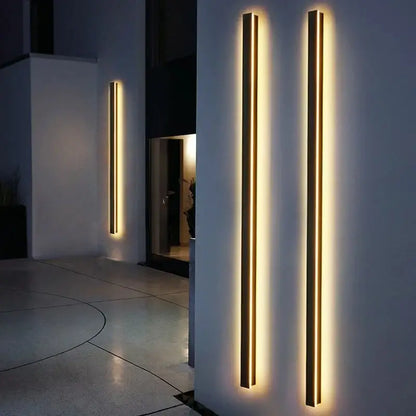 Modern gold-accented DecorBites™ waterproof led outdoor wall light with warm glowing illumination and sleek linear design