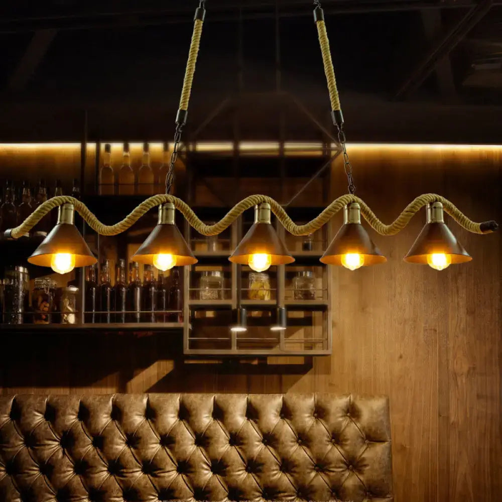 DecorBites wavy hemp rope island light fixture with five brass metal shades suspended by thick beige hemp rope