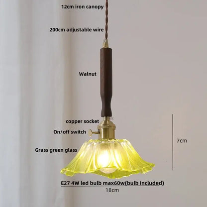 A delicate grass green glass pendant light with dark walnut iron canopy paired with vintage cream white ceramic led pendant light