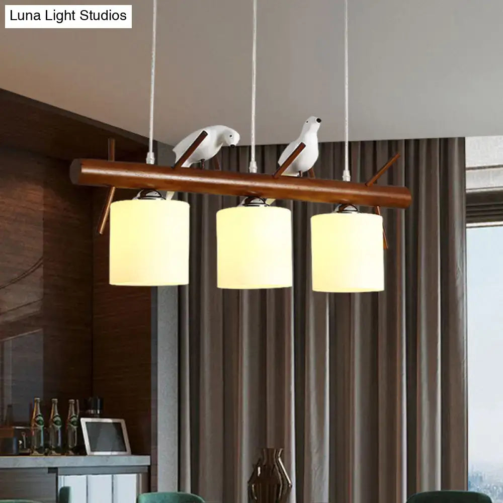 DecorBites white glass led pendant light with wooden cylinder restaurant design and resin bird figurines hanging fixture