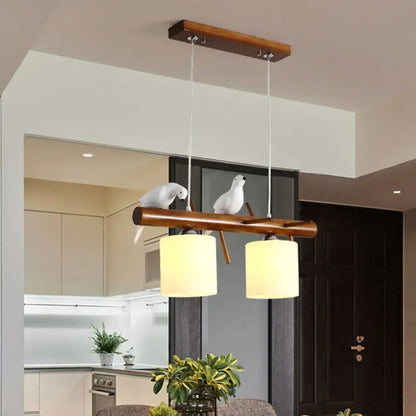 DecorBites™ white glass led pendant light with two cylindrical lampshades and resin bird figurines for cylinder restaurant use