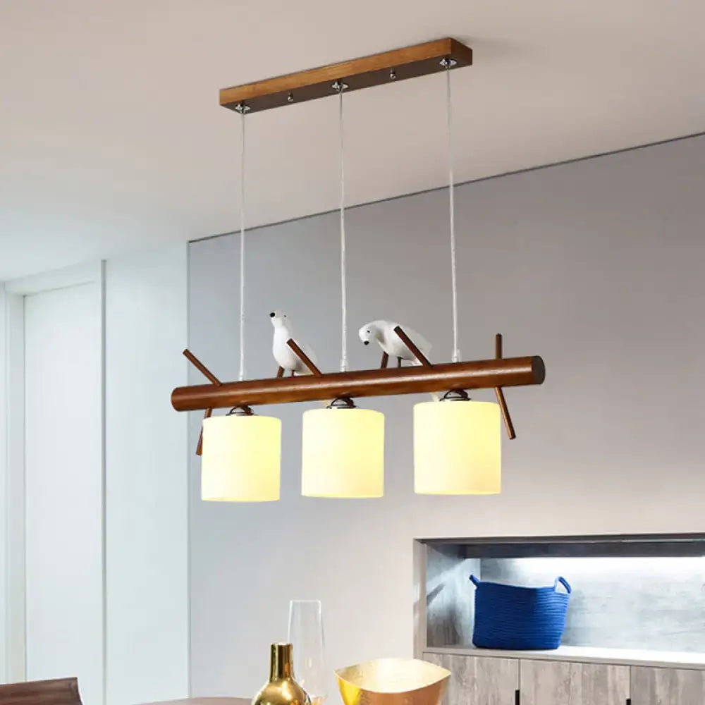 Decorbites™ white glass led pendant light with wooden bar and resin birds features three frosted cylinder restaurant shades
