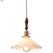 Vintage walnut and white glass led pendant light with warm frosted scalloped shade and dark wood handle suspended by twisted cord