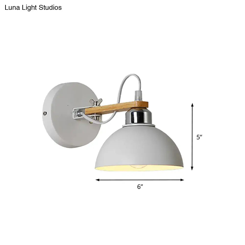 Gray dome-shaped wall light with wooden arm and chrome accents featuring a metal frame and direct wired electric setup