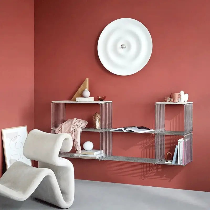 Modern silver wire shelving unit with geometric modular design complementing decorbites white nordic bauhaus round lamp
