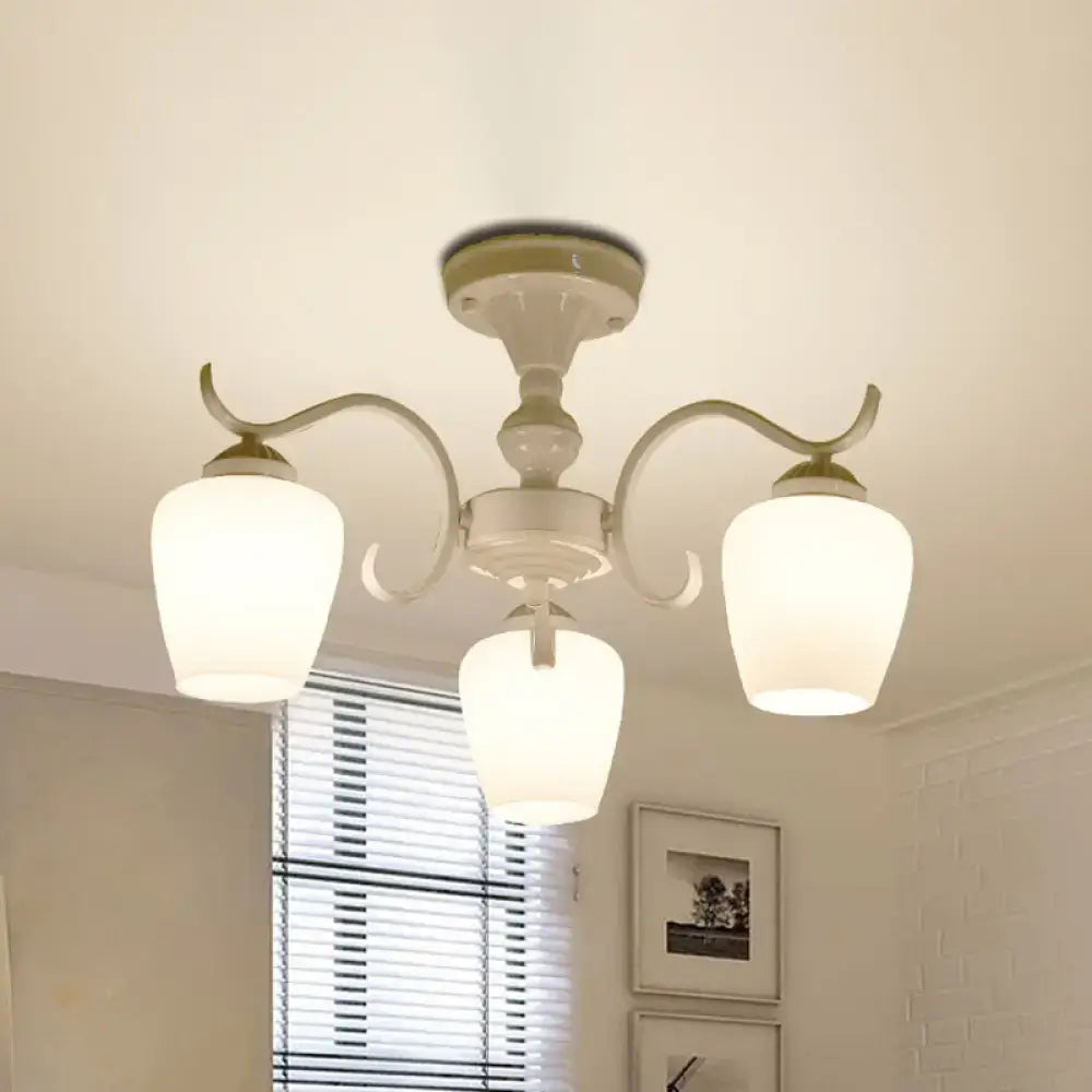 Cream-colored DecorBites™ chandelier with three curved arms and frosted opaline glass cone shades