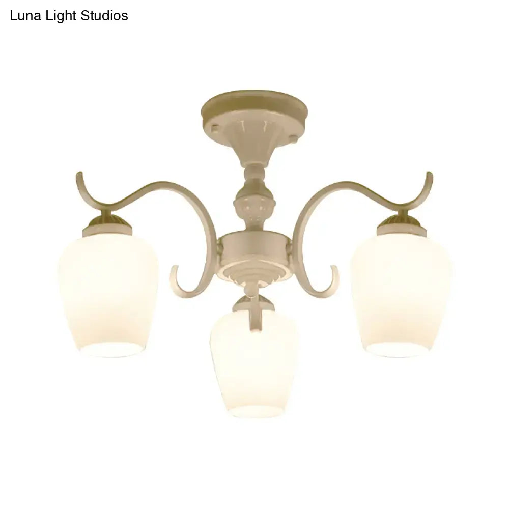 Cream-colored DecorBites™ chandelier with three curved arms and frosted opaline glass cone shades in countryside style