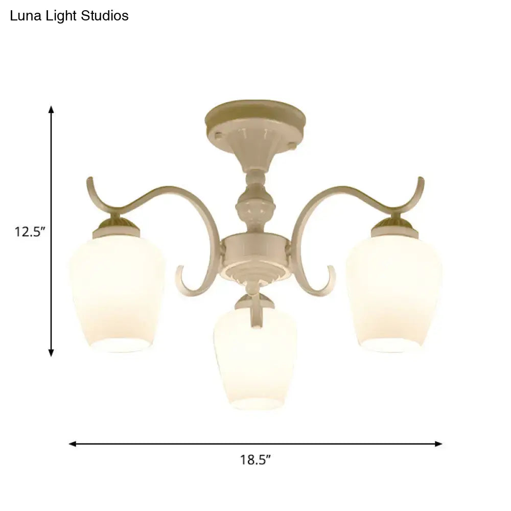 Cream-colored DecorBites™ chandelier with three curved arms and frosted opaline glass cone shades
