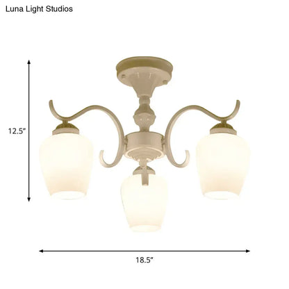 Cream-colored DecorBites chandelier with three curved arms and frosted opaline glass cone shades in countryside style