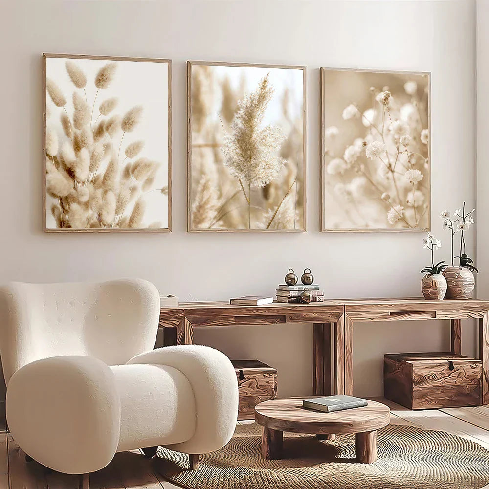 Beige plush armchair with rounded contours and wooden legs next to decorbites™ white seascape canvas set wall art