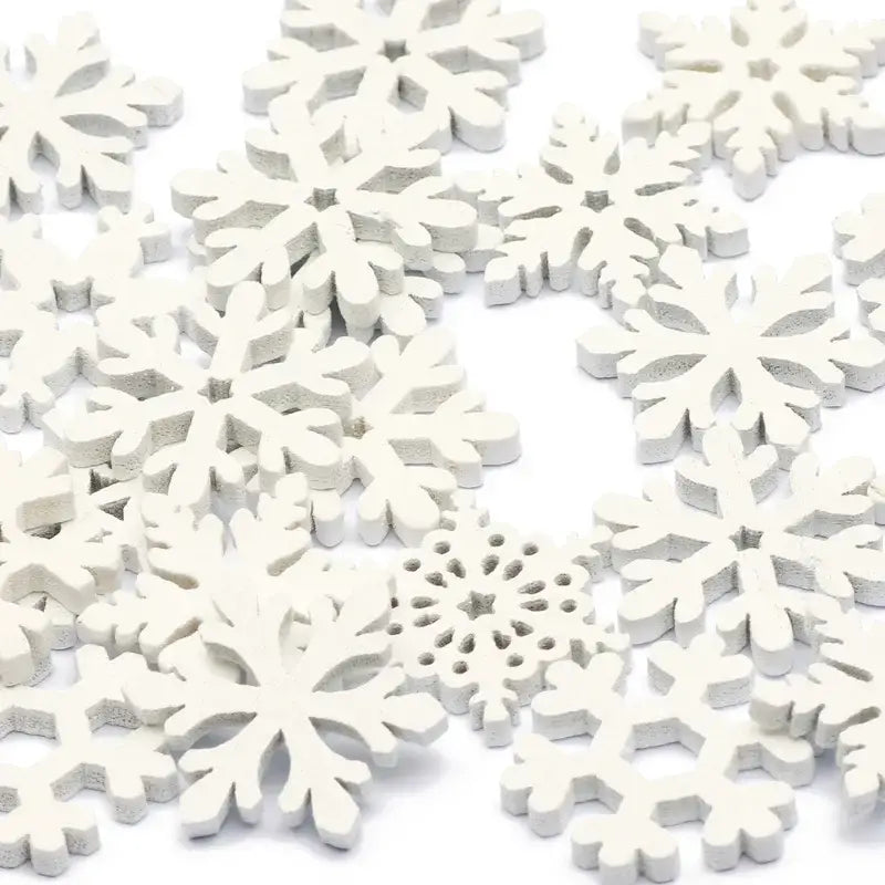 Decorbites™ white wooden snowflake slices with intricate symmetrical designs for christmas crafts and decor