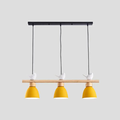 Decorbites wood and metal macaron bowl pendant light with yellow bell shades and white bird figurines mounted on dark blue-gray ceiling with e26 e27 sockets