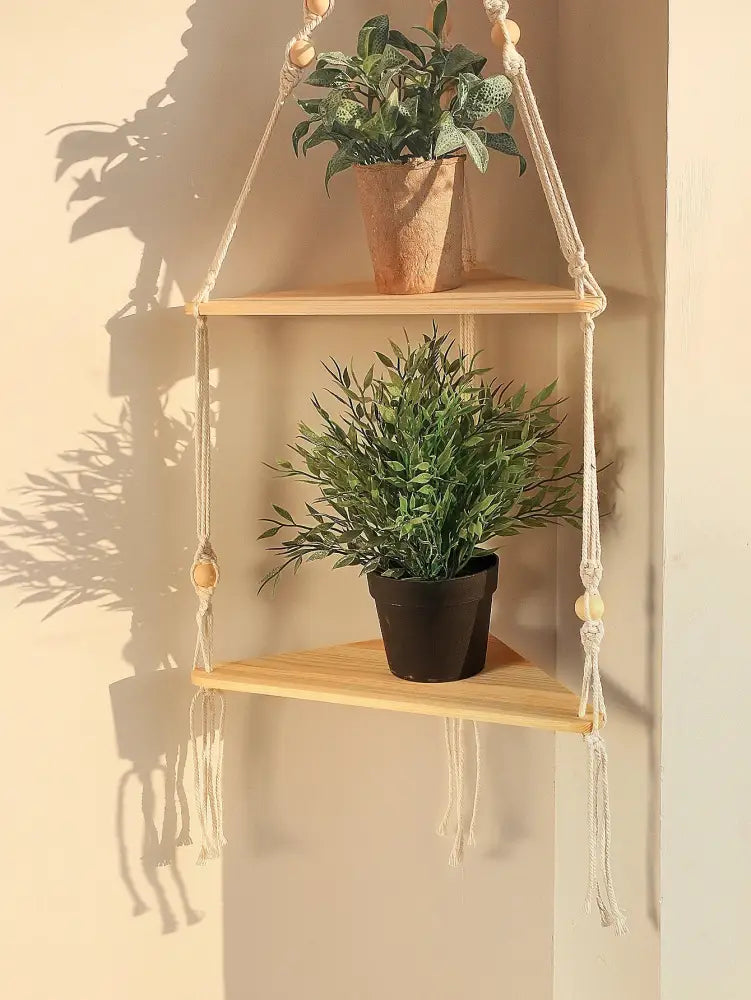 Beige macrame wooden corner shelf with two tiers and decorative beads for boho wall decor by decorbites