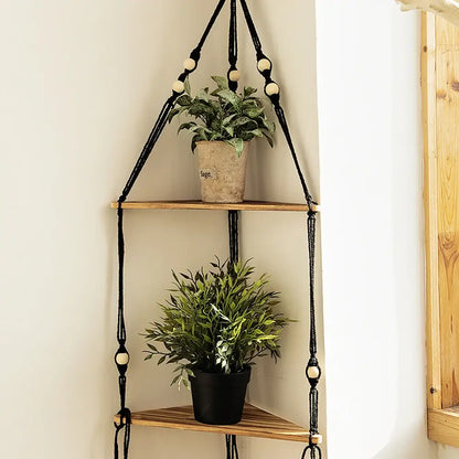 Black macrame hanging wooden corner shelf with wooden tiers and cream-colored beads for boho wall decor