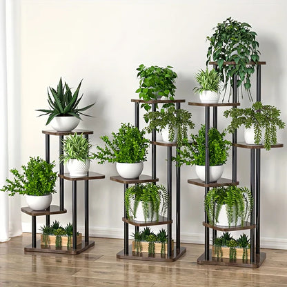 Set of three tiered DecorBites™ wooden flower plant stands with dark brown shelves and black metal frames holding green plants