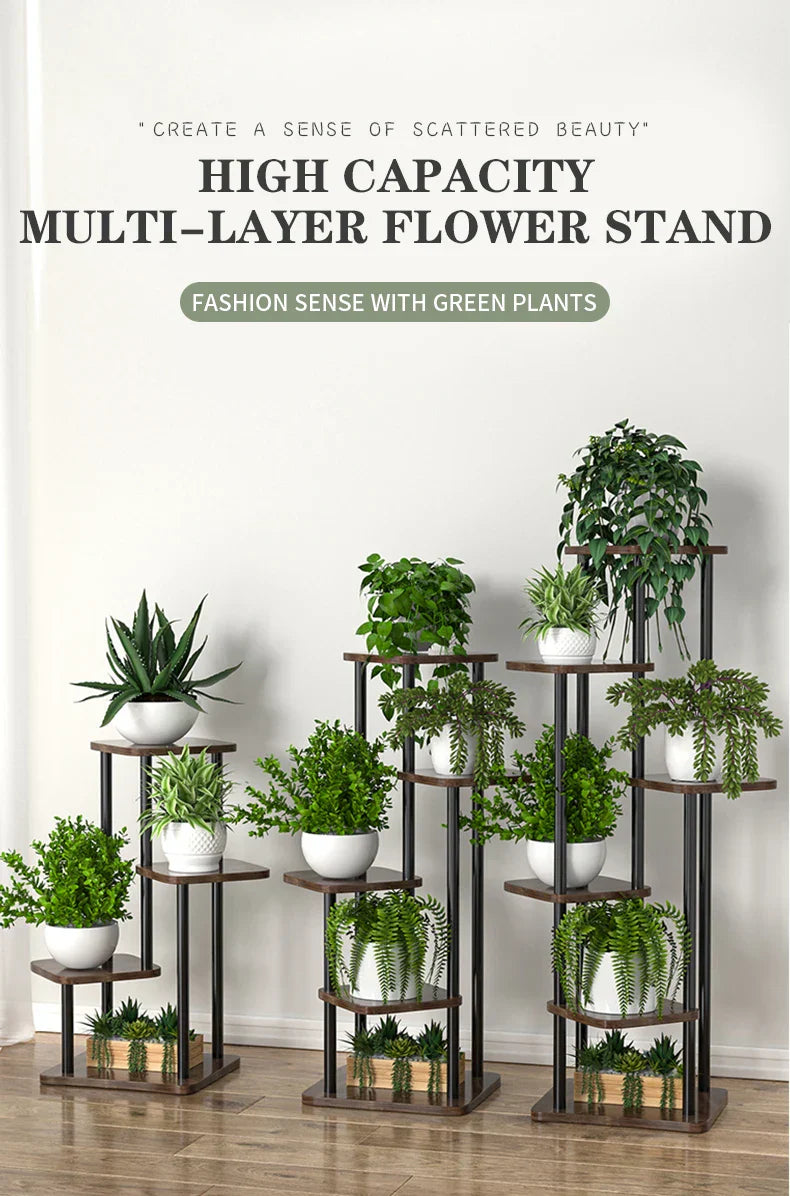 Dark brown metal multi-layer wooden flower plant stand with wooden shelves holding white ceramic pots with green plants