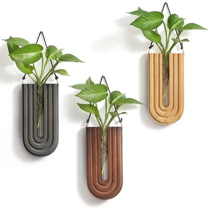 Three decorbites wooden flower vase wall mount holders with u-shaped wooden flower design and green plants