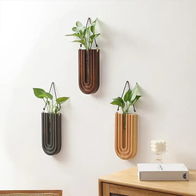 Three hanging decorbites wooden flower vase wall mount holders in modern wooden and ceramic u-shaped designs