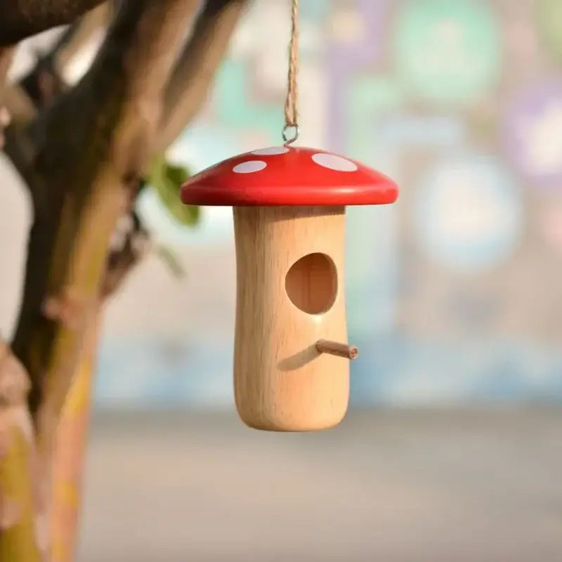 DecorBites™ wooden hanging hummingbird house feeder shaped like a red and white polka-dotted mushroom with wood body