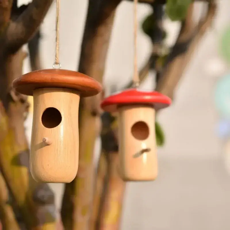 DecorBites™ 1pc outdoor hanging hummingbird house feeder with two whimsical wooden mushroom-shaped designs in natural and red colors