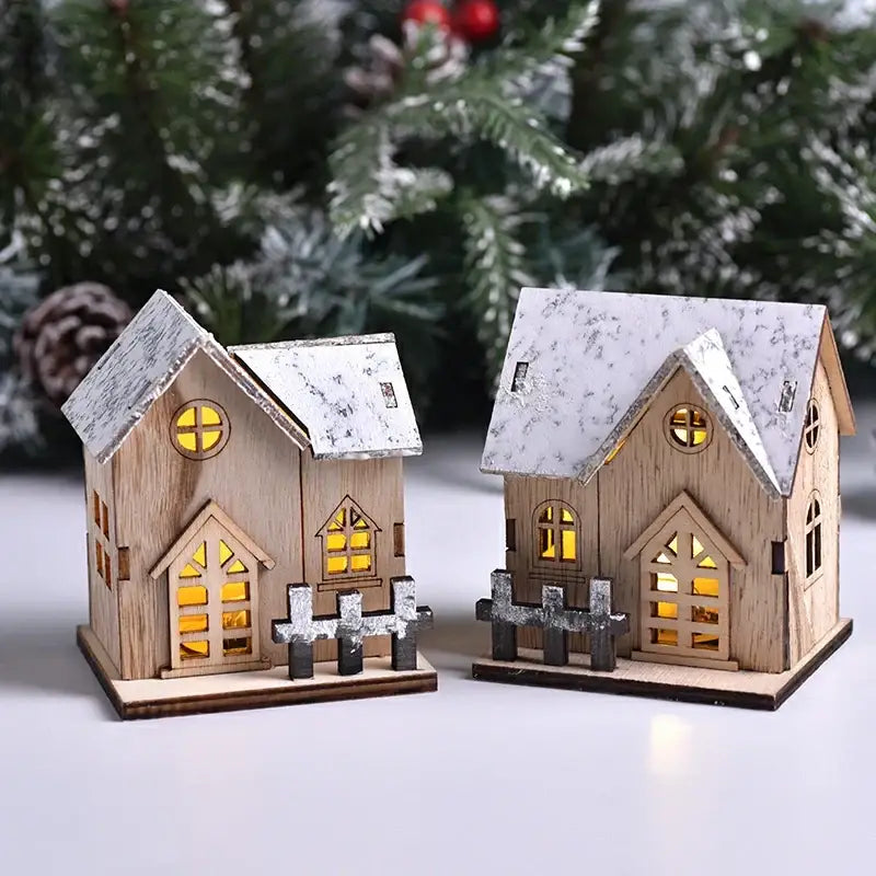 Decorbites™ wooden led light house christmas decorations featuring two snow-dusted miniature houses with glowing yellow lights and picket fences