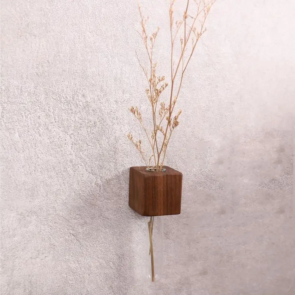 A sleek dark brown wooden cube magnetic test tube vase with a clear glass stem for diy flower arrangement