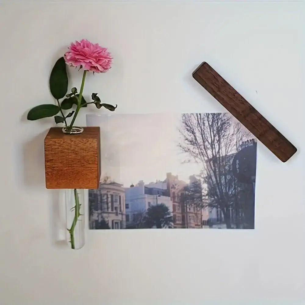 Wooden cube wall-mounted test tube vase by decorbites holding a single pink flower for diy flower arrangement