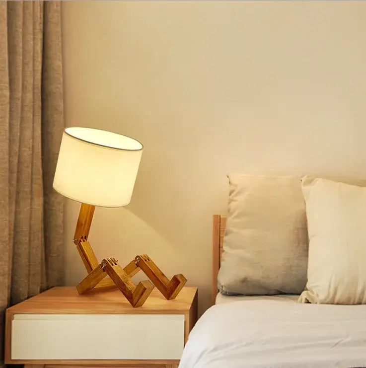 DecorBites wooden robot shape creative table lamp with off-white fabric shade and articulated wooden legs for reading