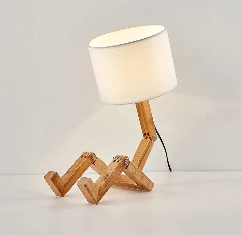 Decorbites wooden robot shape creative table lamp with white shade and articulated wooden legs for indoor study use