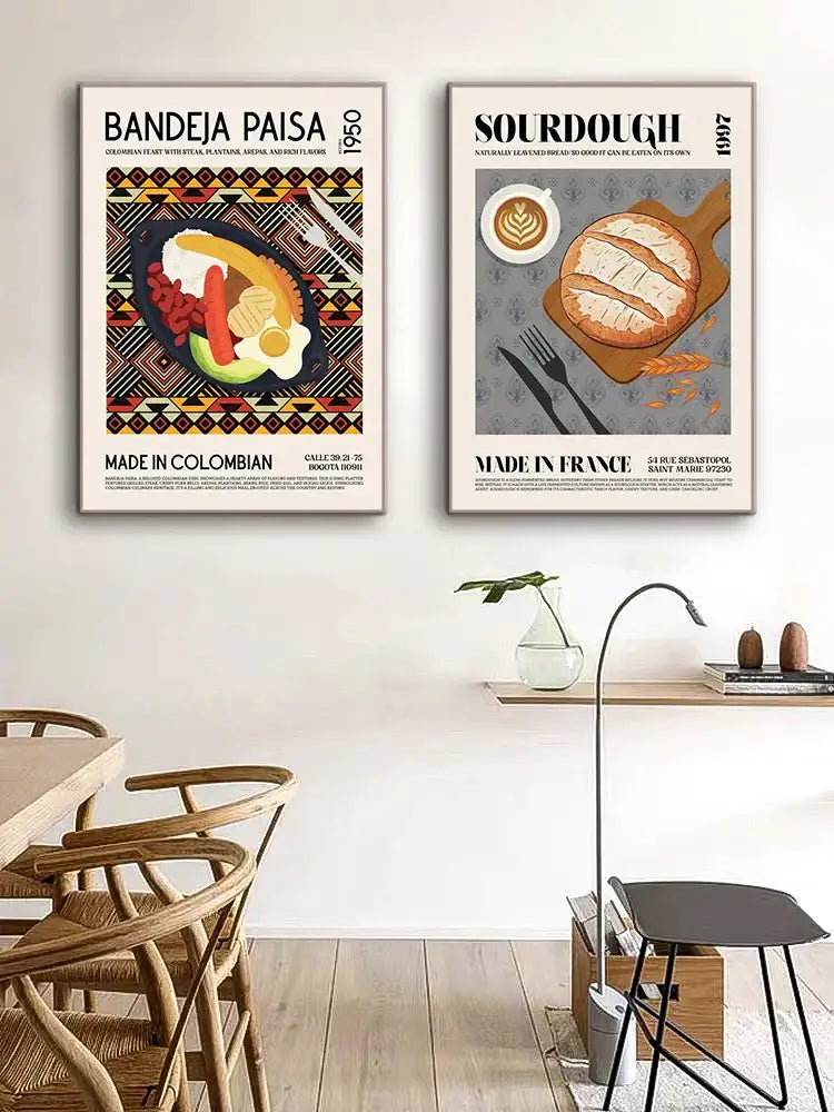 Two framed decorbites™ world cuisine canvas paintings featuring colorful colombian bandeja paisa and rustic sourdough loaf