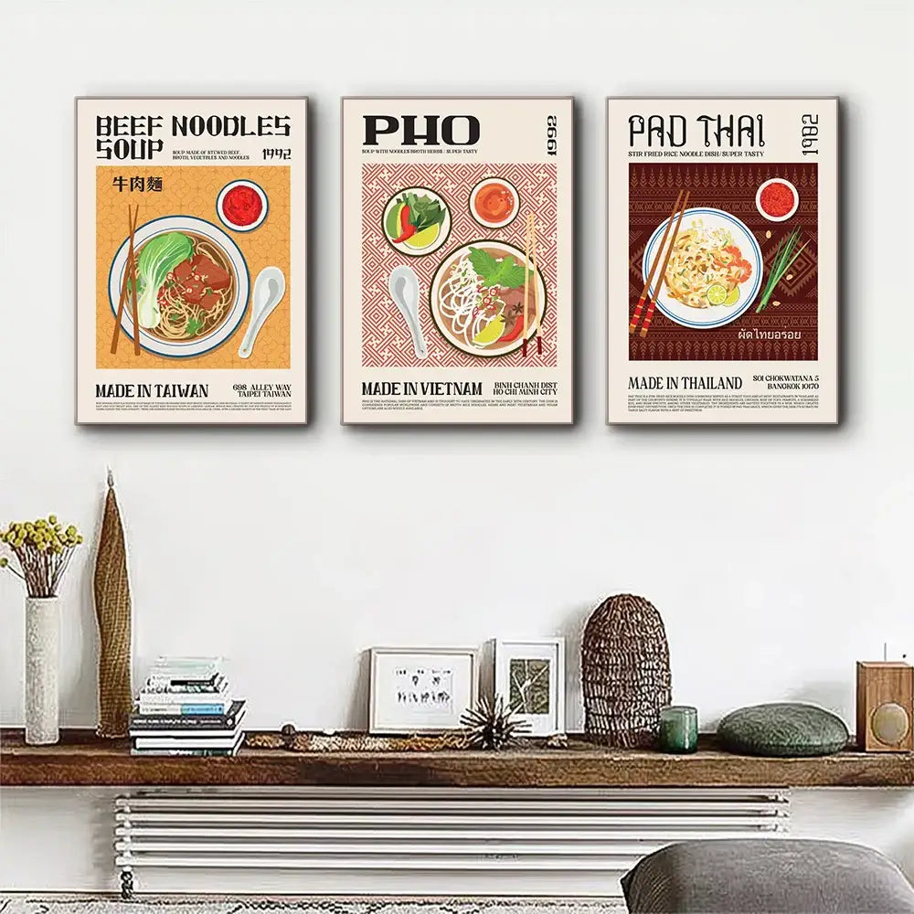 Three vintage-style framed world cuisine canvas posters featuring beef noodles pho and pad thai with colorful illustrations