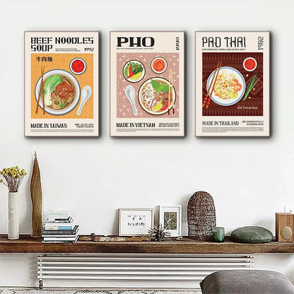 Three vintage-style framed food canvas prints featuring beef noodles pho and pad thai with colorful retro illustrations for world cuisine decor