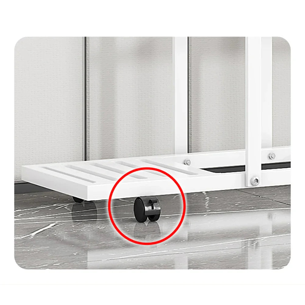 Black caster wheel attached to white wrought iron plant stand for easy mobility in the decorbites™ plant stand