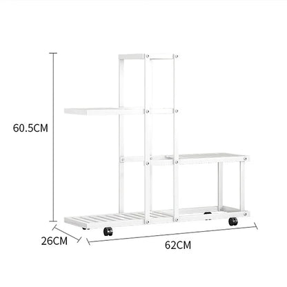 White multi-tiered wrought iron plant stand with wheels and slatted shelves for easy mobility by decorbites