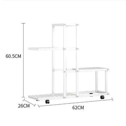 White multi-tiered wrought iron plant stand with wheels and slatted shelves for easy mobility by decorbites