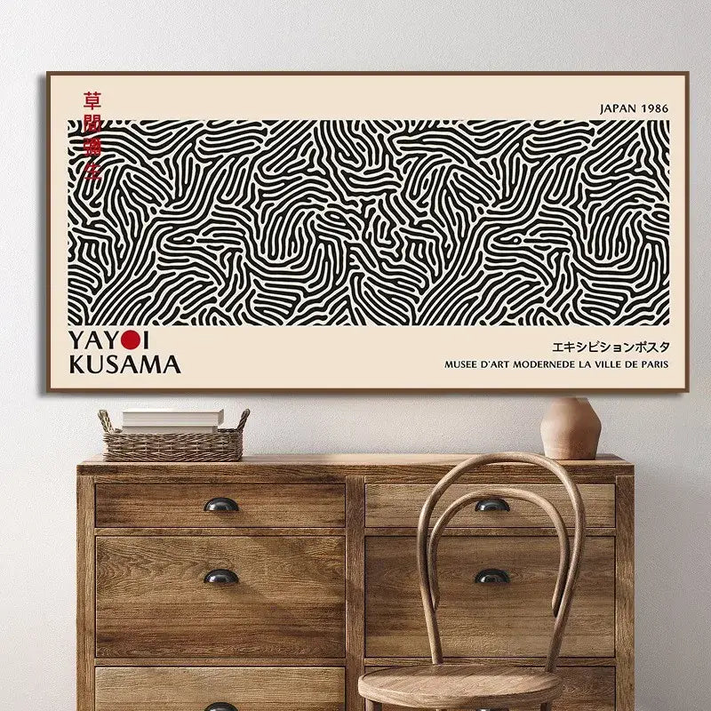 Black and white abstract line art canvas wall art featuring yayoi kusama flower design framed in brown border by decorbites