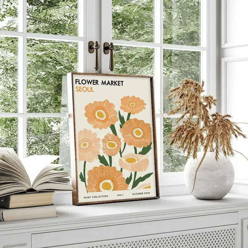 A framed vintage-style floral canvas art with orange flowers labeled flower market seoul inspired by yayoi kusama wall art