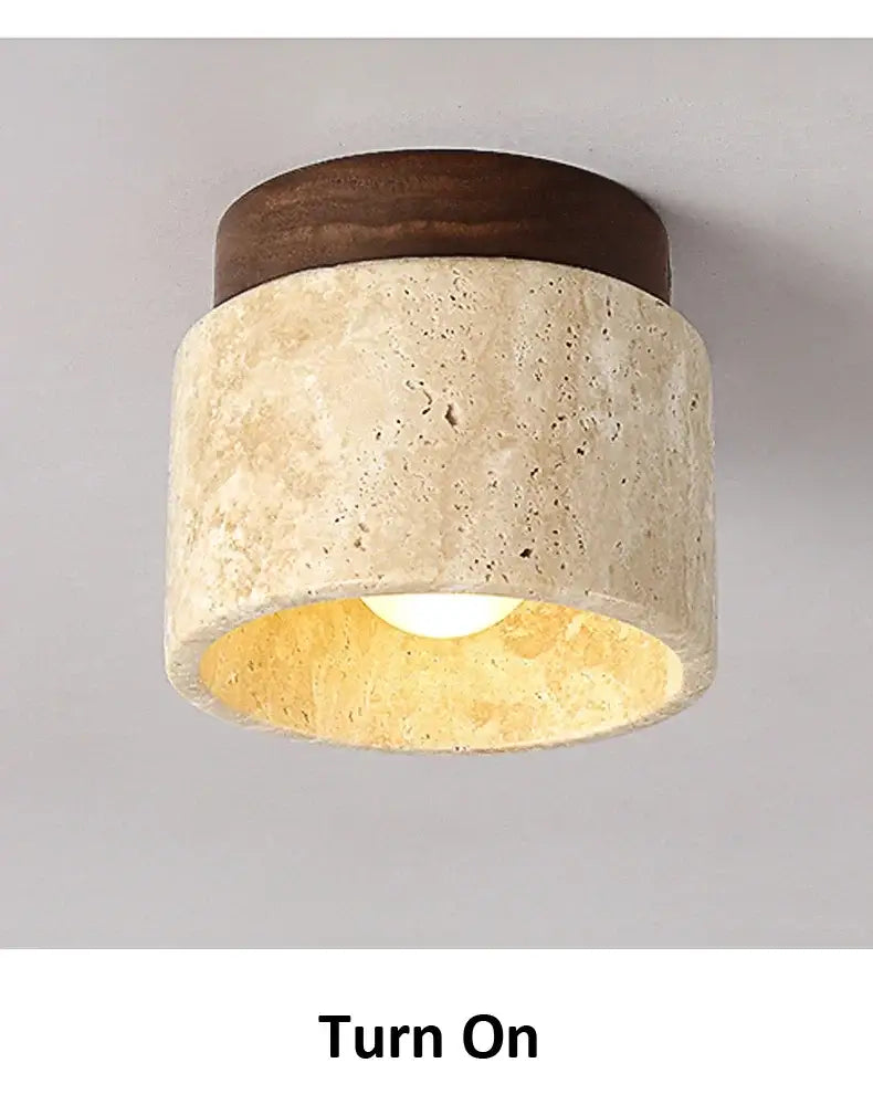 Decorbites™ yellow marble ceiling light with rounded design, dark wood top, and textured beige stone body for home