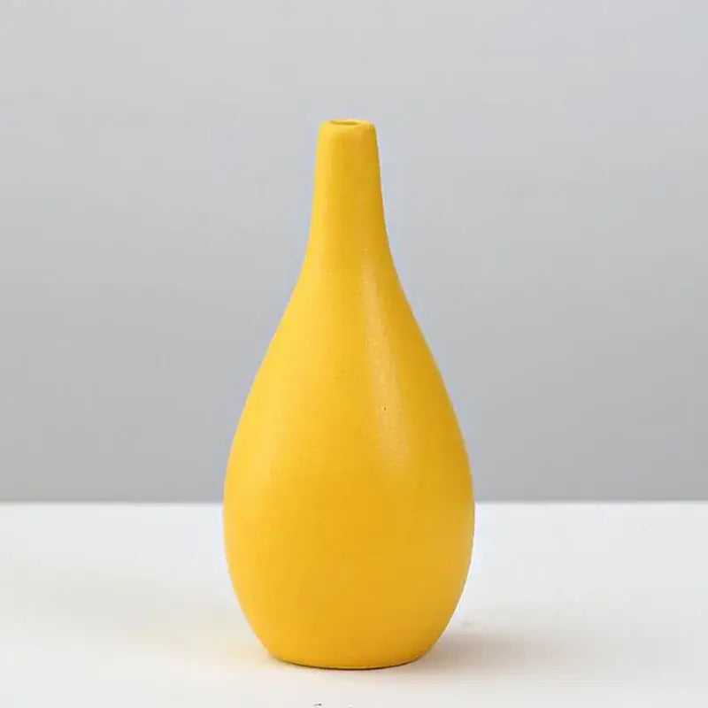 Decorbites™ yellow porcelain flower vase with a sleek matte finish and slender neck for elegant home decor