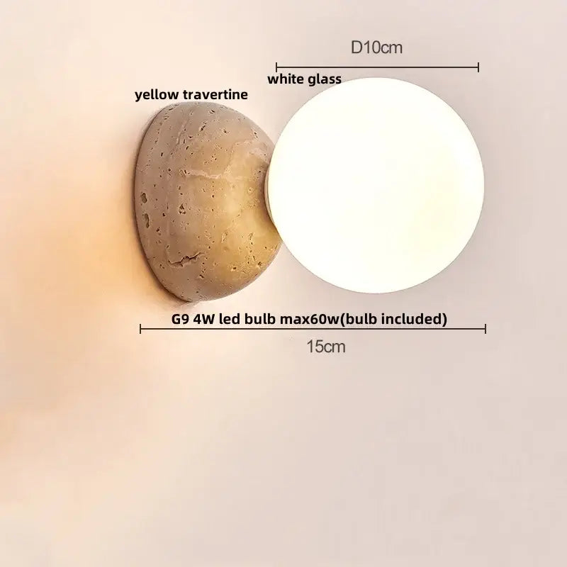 Modern wall sconce with a textured yellow travertine base and smooth white glass globe for bedroom decorbites yellow travertine