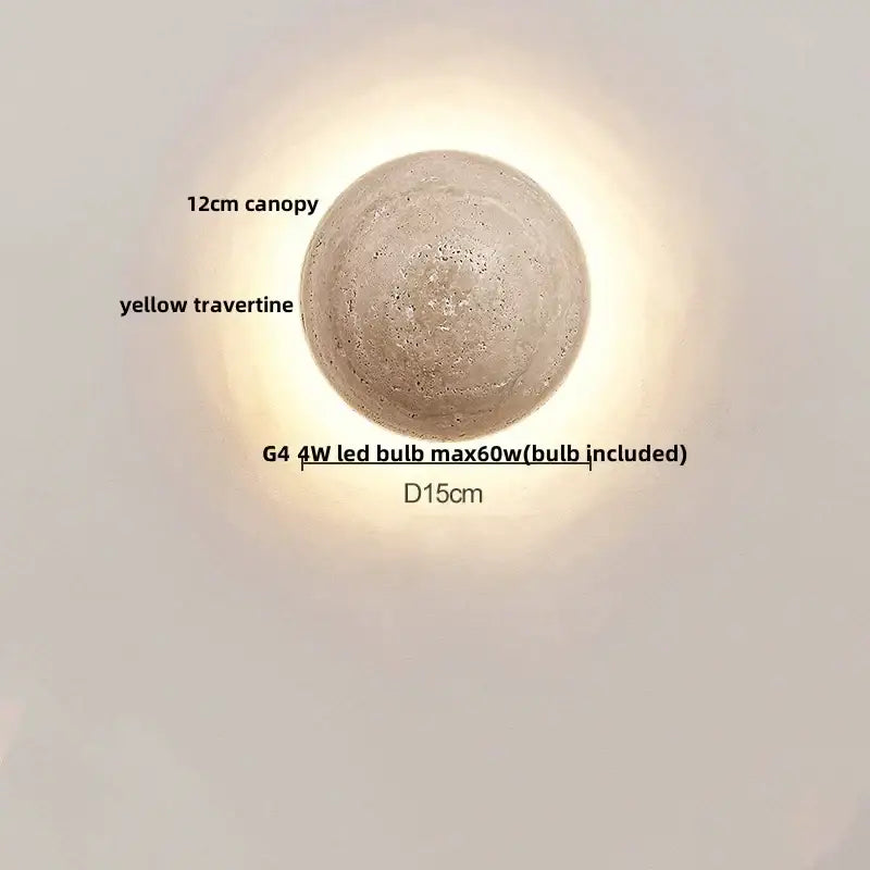 Modern yellow travertine wall sconce with round textured design 15cm diameter and 12cm canopy by decorbites