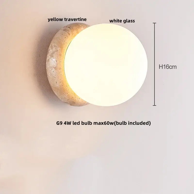 Modern wall sconce with a textured yellow travertine base and smooth white glass globe for bedroom lighting decorbites yellow travertine