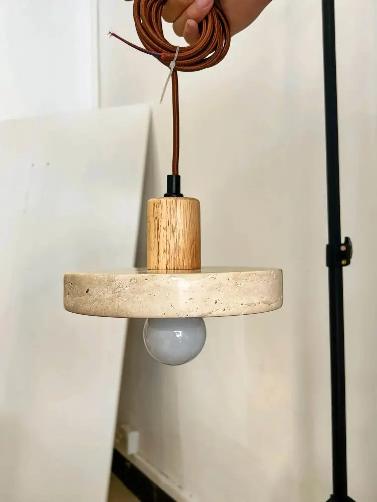 DecorBites™ yellow travertine pendant light with a natural wood cylinder and stone pendant for kitchen island lighting