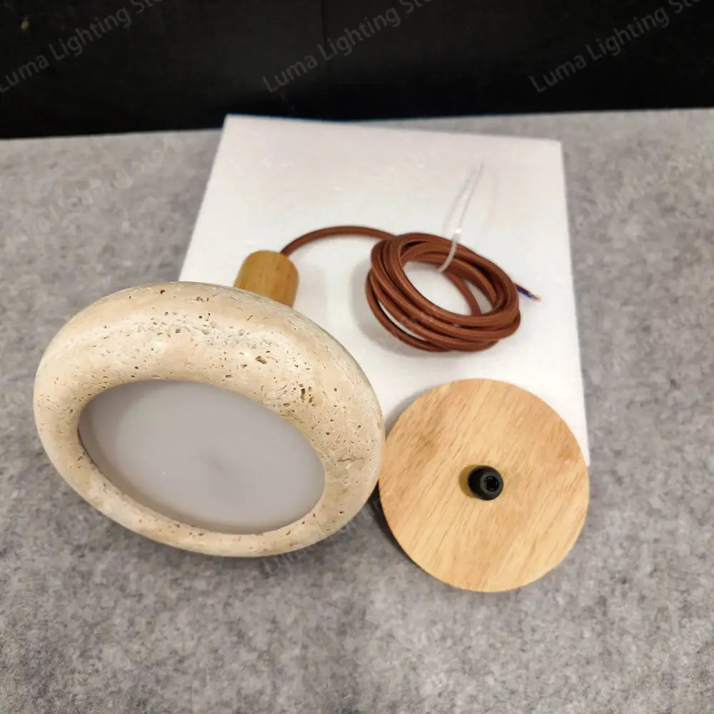 Beige decorbites™ yellow travertine stone pendant light with wooden base and brown cord for kitchen island lighting