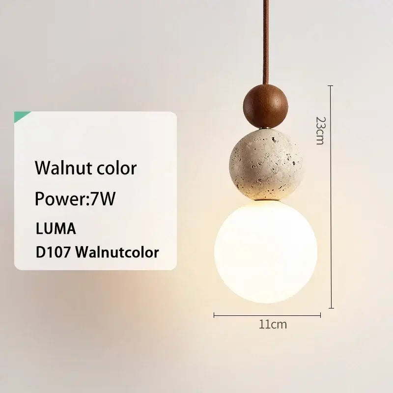 Walnut-colored concrete and wood pendant light with frosted glass globe stone pendant by luma for kitchen island lighting